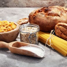 whole grain products with complex carbohydrates on rustic background