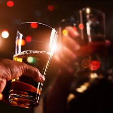 Cheers clinking of friends with beer drink in party night after work on colorful blur  background, Group of young people happy having fun together with friendship.